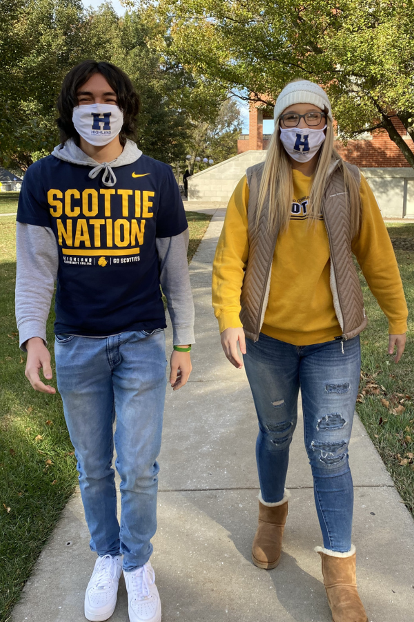 Two students walking with masks